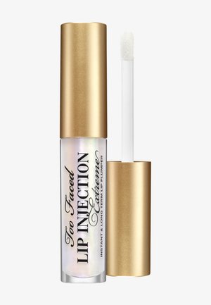 Too Faced Lip Injection Extreme, heldere tube met iriserende glans, gouden metalen dop, vergezeld door een witte applicatiewand.