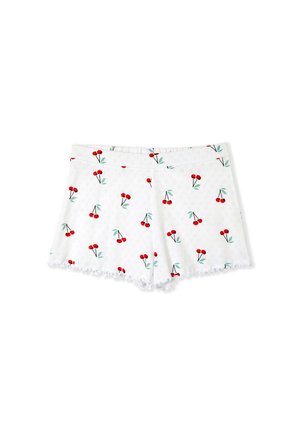 White shorts with a cherry print, featuring red cherries and green leaves on a textured fabric. Scalloped hem detail adds a decorative touch.