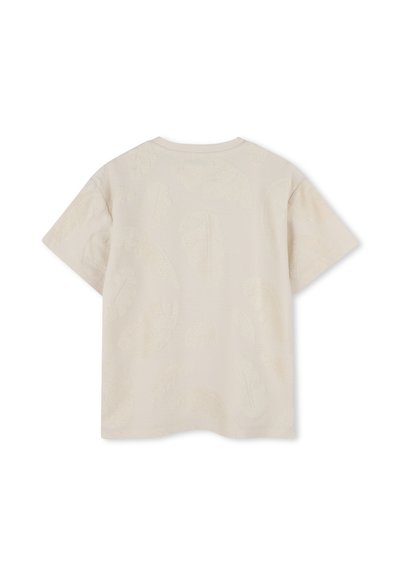 T-shirt beige clair à manches courtes avec des motifs de feuilles texturés. Encolure ronde et coupe décontractée, confectionnée en coton doux.