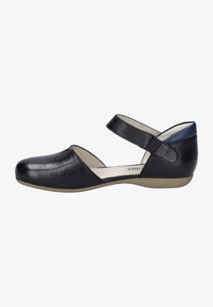 Black leather flat shoe with a rounded toe, single adjustable strap, low heel, and soft inner lining. Smooth texture with minimal detailing.