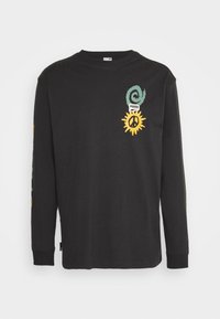 Black long-sleeve t-shirt made of cotton. Features colorful graphic prints, including a swirl, sun, and peace symbol on the front.