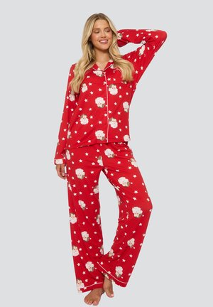Red pajama set featuring a printed pattern of cartoon sheep and stars, made from soft fabric, with a button-up top and loose-fitting trousers.
