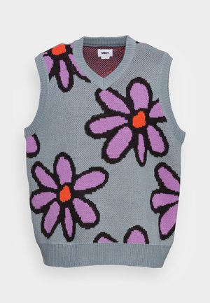 Ærmeløs grå strikket vest med V-hals, prydet med store lilla blomster med sorte konturer og orange midter.