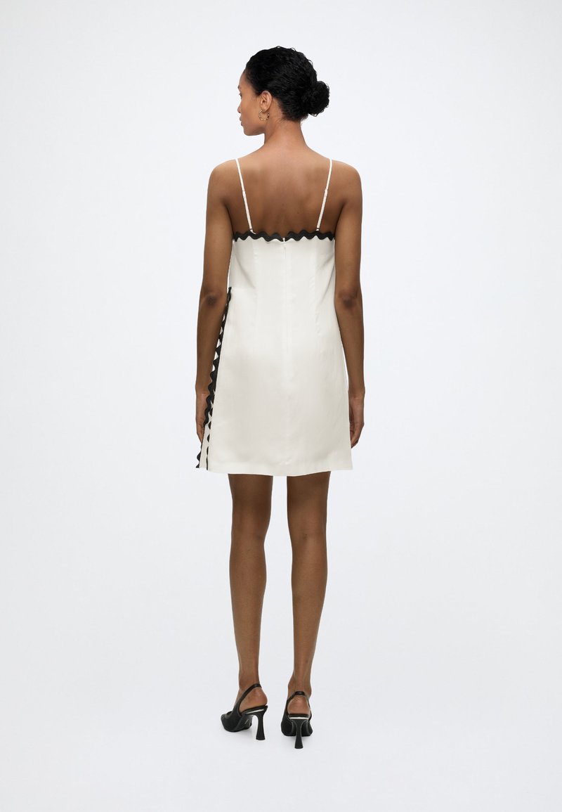 white dress with black stitching Sweetie White Mesh Long Sleeve Mini Dress - US 8
