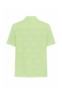 Chemise vert clair à manches courtes avec de subtils motifs floraux en œillet découpés et un col classique, vue de dos.