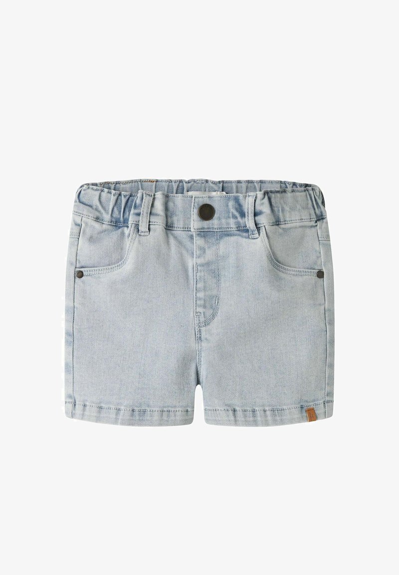 Hele sinised teksapüksid elastse vöökohaga, esikinnis nuppude ja vööklambritena, kahe ees oleva taskuga ja väikese pruuni sildikesega äärel.