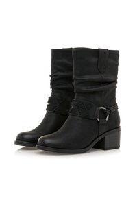 Bottines noires à la cheville au design décontracté, sangle texturée avec des accents géométriques, bout rond et talon bloc. Matériau synthétique lisse.
