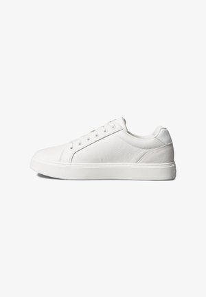 White low-top sneaker with textured leather upper, lace-up closure, padded collar, and thick rubber sole on a white background.