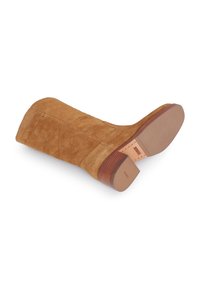 Suede brown ankle boot with a square toe, tapered wooden heel, and textured rubber sole; features visible stitching and a smooth finish.