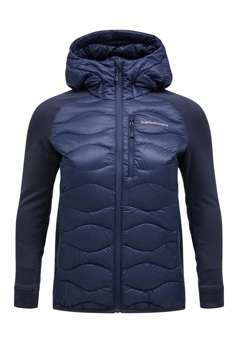 Giacca insulated blu navy con frontale trapuntato, cappuccio e maniche lunghe. Presenta una tasca laterale con zip e una texture liscia sulle braccia.