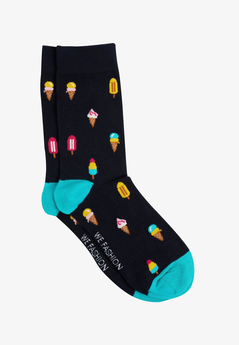 Calcetines navy con alegres patrones de helados y polos. Presentan puños en turquesa y un detalle de texto tejido en la punta. Material de mezcla de algodón.