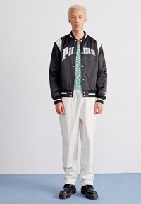 Puma FOR THE FANBASE VARSITY - Bombejakke - black