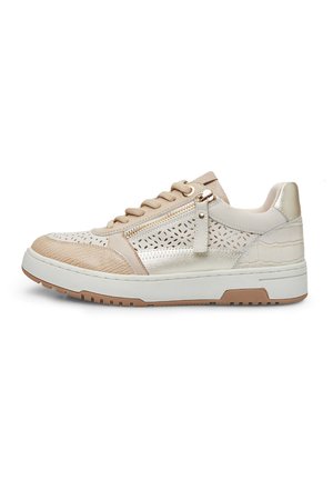 Beige sneaker with textured fabric, metallic accents, perforated designs, rubber sole, and side zipper detail. Athletic style with modern elements.