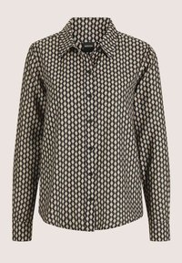 Schwarze und cremefarbene Bluse mit Knopfleiste, Diamantmuster, langen Ärmeln, Kragen und geradem Saum. Der Stoff hat eine glatte Oberfläche.