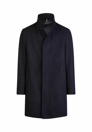 Tamsiai mėlynos vilnos mišinio paltas, su aukšta apykakle, dvigubais mygtukais ir šoninėmis kišenėmis. Lygus paviršius, pritaikytas siluetas.