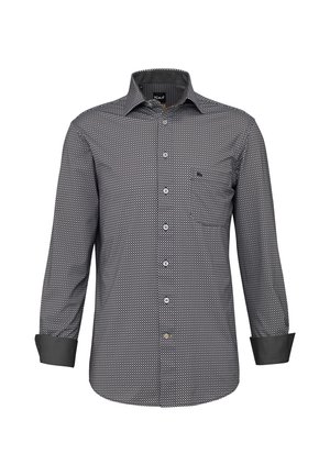 Camicia a maniche lunghe con motivo pied-de-poule bianco e nero, dotata di una pattina con bottoni, colletto e una tasca sul petto; polsini neri a contrasto.