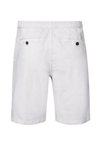 Lys beige bomuldsshorts med elastisk talje, to baglommer med sorte knapper og minimal syning.