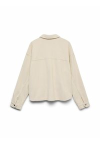 Beige kordflorskjorta med jacka-stil, som har krage, långa ärmar med knappmanchetter och en avslappnad passform. Strukturerad tyg med synliga ribbor.