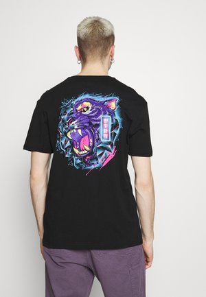 Black cotton t-shirt featuring a vibrant, graphic design of a roaring purple panther surrounded by blue geometric shapes.