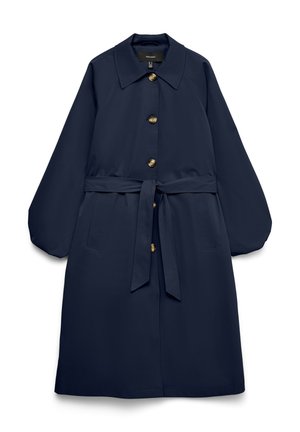 Μακρύ παλτό σκούρου μπλε με μεγάλα κουμπιά, μέση με ζώνη, φαρδύ γιακά, λοξές πλαϊνές τσέπες και μανίκια μακριά σε στυλ μπαλόνι.