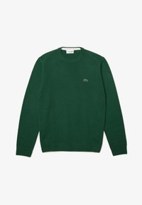 Pull à manches longues vert foncé avec col rond, petit logo crocodile brodé sur la poitrine gauche, étalé à plat sur fond blanc.