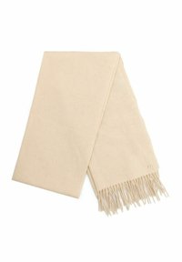 Beżowy wełniany szalik z frędzlami na końcach i małym kwadratowym metalowym logo obok jednego z frędzli, wyeksponowany na białym tle.