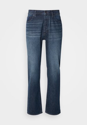 Denimjeans med rak bendesign, medeltvätt, femfickorsstil och knäppning. Tyget har en jämn struktur med lätt urtvättning.