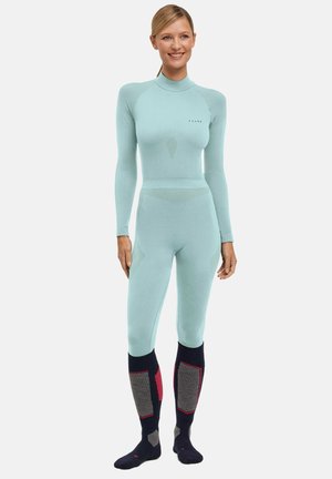 Light blue full-body suit with long sleeves, ribbed texture, and seamless design. Paired with dark blue socks featuring gray and red accents.