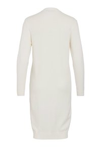 Långärmad, knälång, vit stickad klänning med ribbade muddar och nederkant, visad bakifrån mot en enfärgad vit bakgrund.