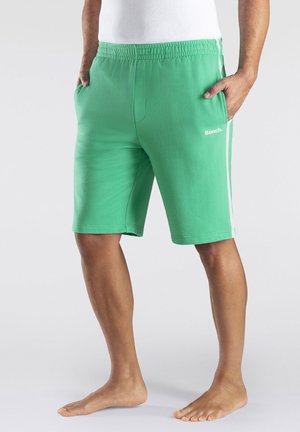 Green cotton blend shorts with an elastic waistband, side pockets, and white side stripes. The brand logo "Bench." is displayed on the front.
