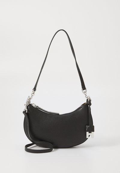 Black leather handbag with curved design and zipper closure. Features a detachable shoulder strap and silver hardware accents.