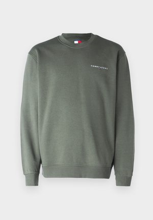 Olīvu zaļš sporta krekls ar apaļu kakla izgriezumu, ribotām piedurknēm un apakšmalu, uz krūtīm ir balts "TOMMY JEANS" logo. Lins ar kokvilnas piejaukumu.