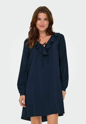 Robe bleu marine à manches longues, avec un col volanté et des détails à cordon. Fabriquée en tissu léger avec une coupe décontractée et une longueur jusqu'aux genoux.