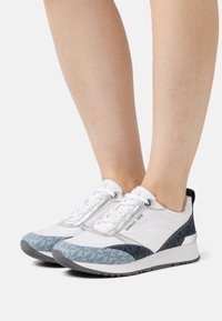 White and blue sneakers featuring a mixed material design with mesh and patterned accents, lace-up closure, and a textured sole.