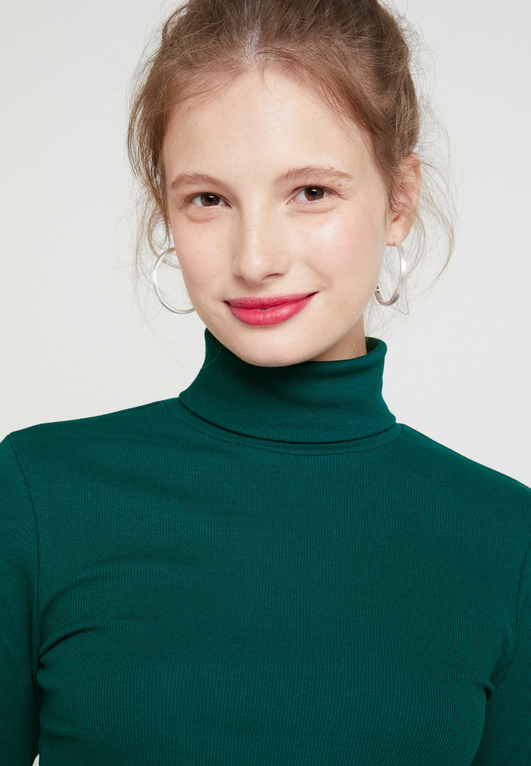 green turtleneck top