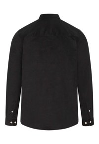 Camicia di velluto a coste nera con yoke posteriore, maniche lunghe, polsini con bottone e una texture liscia. Presenta piccoli bottoni bianchi sui polsini.