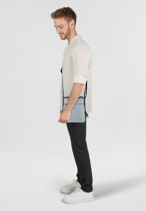 Jost TOLJA MINI - Cross body bag - hellgrau