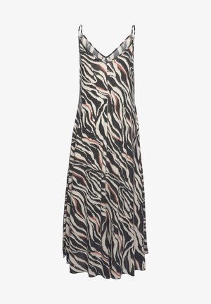 Robe sans manches avec un imprimé zèbre en zigzag noir, blanc et avec des accents subtils d'orange. Tissu léger avec un design fluide.