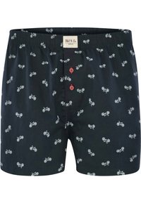 Boxers noirs avec un motif de bicyclettes blanches, dotés de boutons rouges et d'une taille élastique. Étiquette du fabricant en haut.
