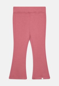 Leggings evasê cor-de-rosa feitos de um tecido suave e elástico. Apresentam uma cintura elástica e costura uniforme nas bordas.