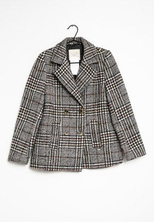 Rutig dubbelknäppt jacka i grått, svart och vitt, med en stor slagkrage och två framfickor, tillverkad av ett strukturerat tyg.