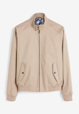 Giacca bomber beige chiaro con colletto alto, chiusura zip frontale, due tasche laterali e fodera a fantasia floreale. Realizzata in tessuto morbido, con polsi e orlo a costine.