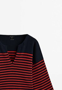 Navy blue and red striped pullover sweater with a V-neck and ribbed texture. Features horizontal stripes of varying widths.