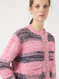 Pink and navy striped knitted cardigan with a ribbed collar, gold rose-button closure, and front pockets. Chunky texture and relaxed fit.