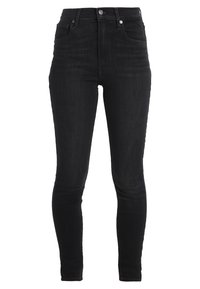 Jeans skinny de mezclilla negra con una cintura alta, cinco bolsillos y presillas para cinturón. Presenta un ligero desgastado y una textura suave.