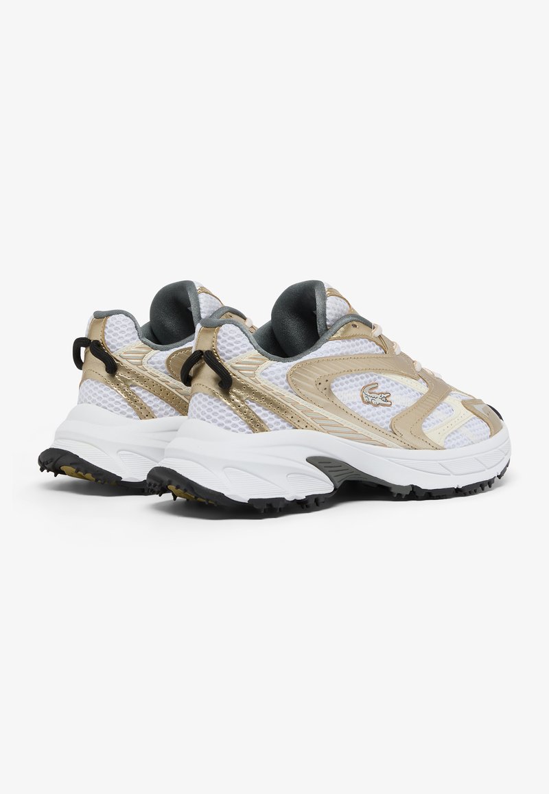 White and gold athletic sneakers with mesh upper, rubber outsole, textured detailing, and black accent on the sole. Features logo on side.