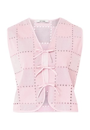 Light pink sleeveless vest with square eyelet pattern and three front tie closures, labeled Ivy Oak.