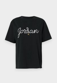 T-shirt in cotone nero a maniche corte con la scritta "Jordan" in strass e un'accentuazione dorata del logo Jumpman sotto il testo.