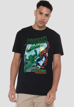 Young man wearing black Spider-Man t-shirt featuring Spider-Man and Scorpion in a comic-style action fight scene.