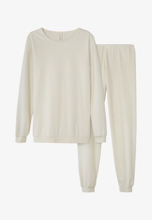 Completo da loungewear beige chiaro composto da una maglia a maniche lunghe con colletto a girocollo e pantaloni abbinati con vita elastica e caviglie a costina. Tessuto morbido e liscio.